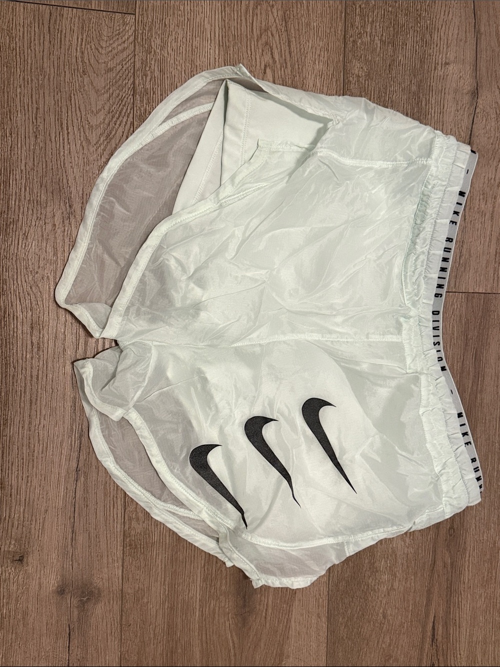 Nike White Athletic Shorts with Black Swoosh Trio